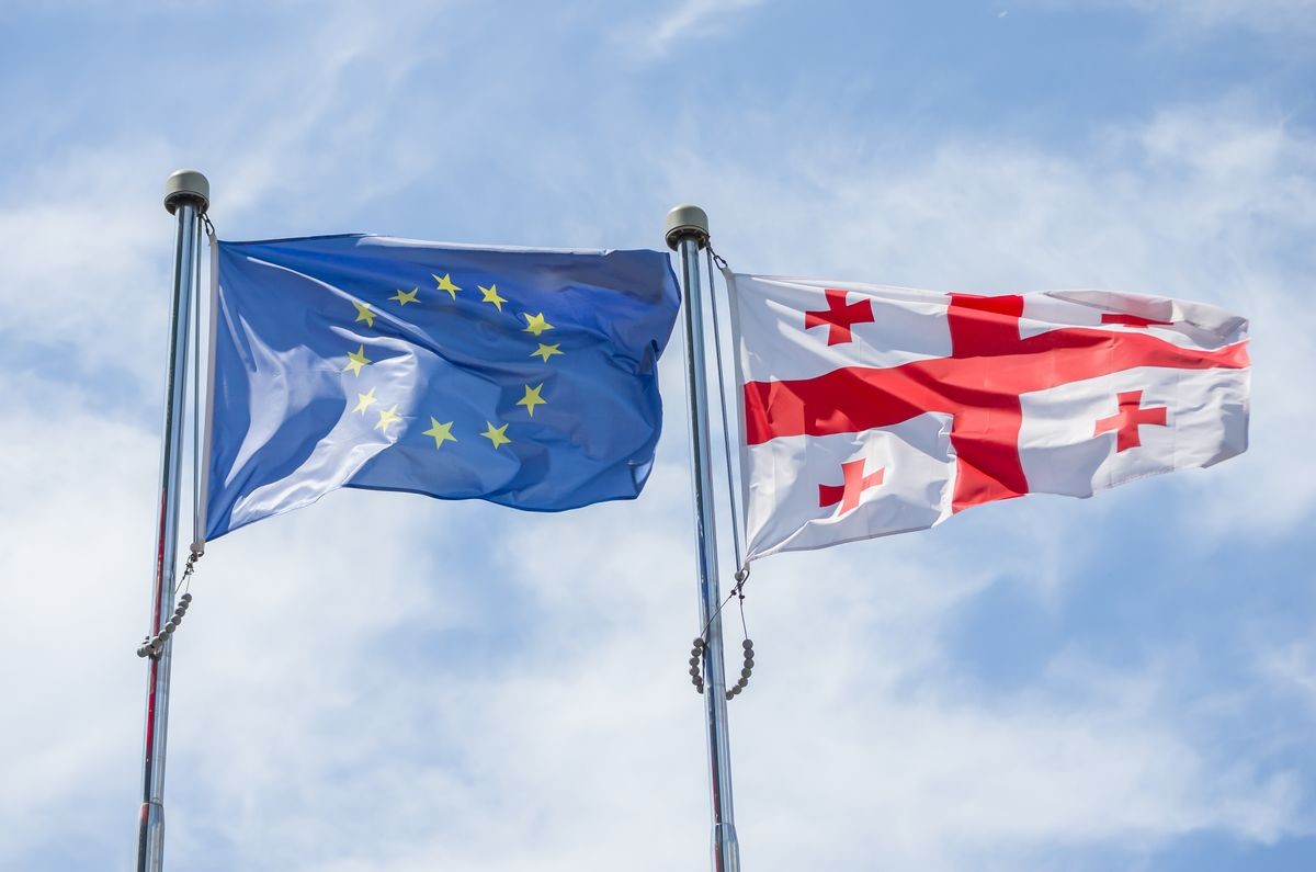 
flag of european union and georgia against sky